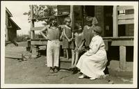 American Women's Hospitals Service and an Appalachian Mountain family (photograph), circa 1935<blockquote class="juicy-quote">An [unidentified] doctor (in hat) from the American Women’s Hospital Service sits on the front steps of a porch in rural 1930s Appalachia with a local woman and children.</blockquote><div class="view-evidence"><a href="https://doctordoctress.org/islandora/object/islandora:1859/story/islandora:2084" class="btn btn-primary custom-colorbox-load"><span class="glyphicon glyphicon-search"></span> Evidence</a></div>