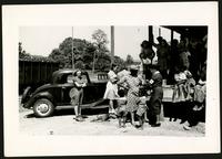 American Women's Hospitals, Rural Services mobile clinic vaccinating a woman (photograph), circa 1935<blockquote class="juicy-quote">An American Women’s Hospital doctor (in hat and “AWH” armband) administers a shot to a local woman in Jellico, Tennessee.</blockquote><div class="view-evidence"><a href="https://doctordoctress.org/islandora/object/islandora:1859/story/islandora:2086" class="btn btn-primary custom-colorbox-load"><span class="glyphicon glyphicon-search"></span> Evidence</a></div>